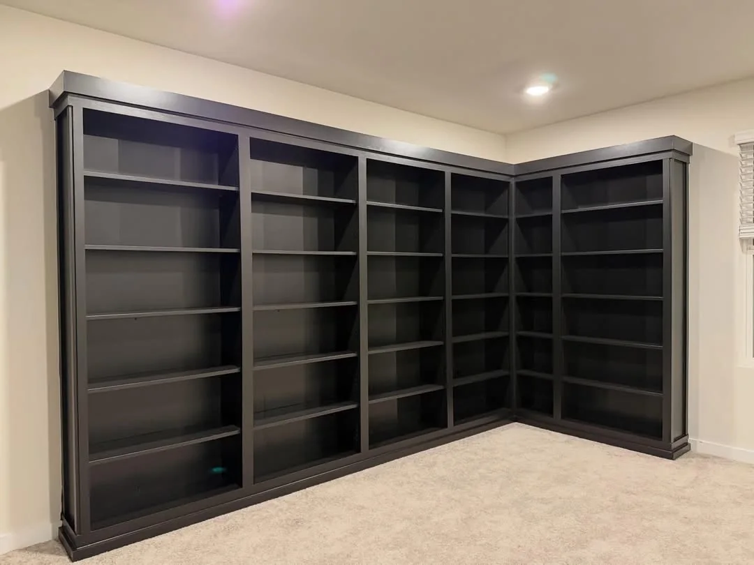 Dark floor-to-ceiling built-in cabinet storage